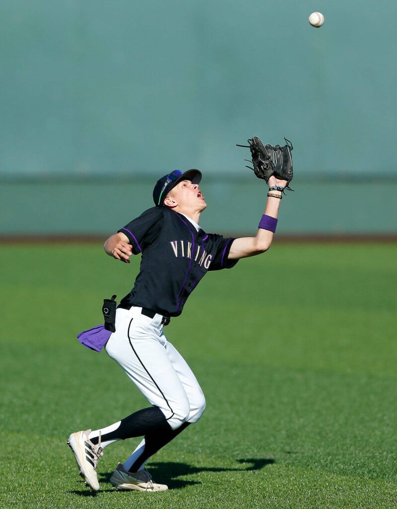 Lake Stevens’ Seth Mahler gets under a fly ball against Jackson during a Wesco 4A District 1/2 game on Thursday, May 11, 2023, at Funko Field in Everett, Washington. (Ryan Berry / The Herald)
