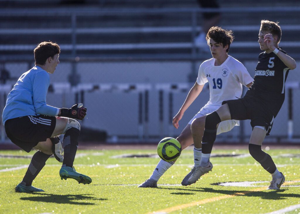 Jackson’s Ian Friedrichsen attempts to get the ball past Bothell goalie Jackson Brown during the game on Thursday, May 11, 2023 in Everett, Washington. (Olivia Vanni / The Herald)
