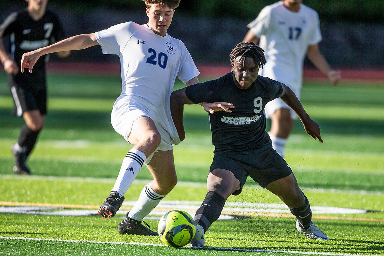 Jackson’s Jaden Oguda fights for the ball with Bothell’s Leif Rietz during the game on Thursday, May 11, 2023 in Everett, Washington. (Olivia Vanni / The Herald)