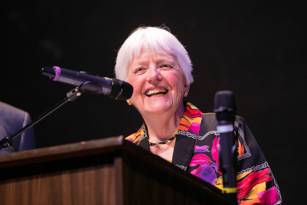 June Remboldt Aprille, of the EHS Class of 1963, laughs before presenting a scholarship during Everett High School’s Scholarship Awards Night on Wednesday at the Everett Civic Auditorium. (Ryan Berry / The Herald)
