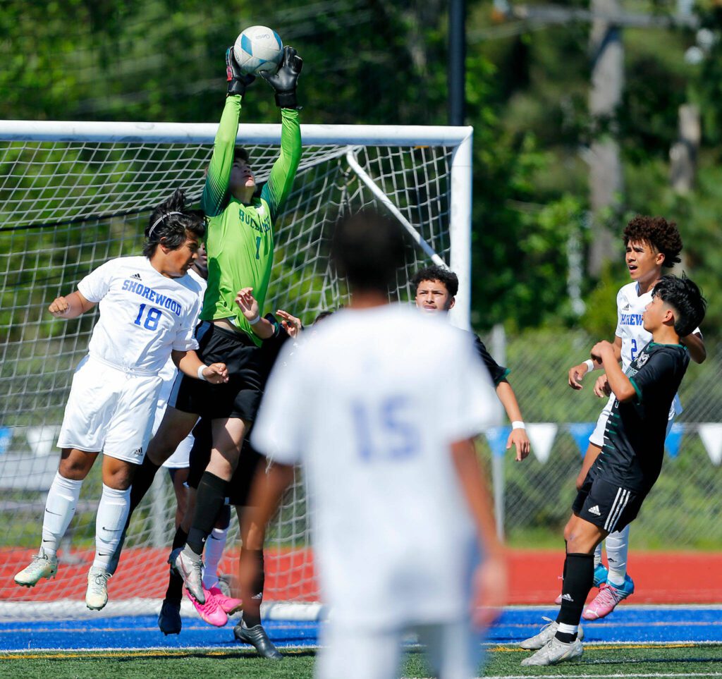 Mount Vernon goaltender Jesus Garcia goes up high to come down with a 50/50 ball against Shorewood during the 3A District Championship match on Saturday, May 13, 2023, at Shoreline Stadium in Shoreline, Washington. (Ryan Berry / The Herald)

