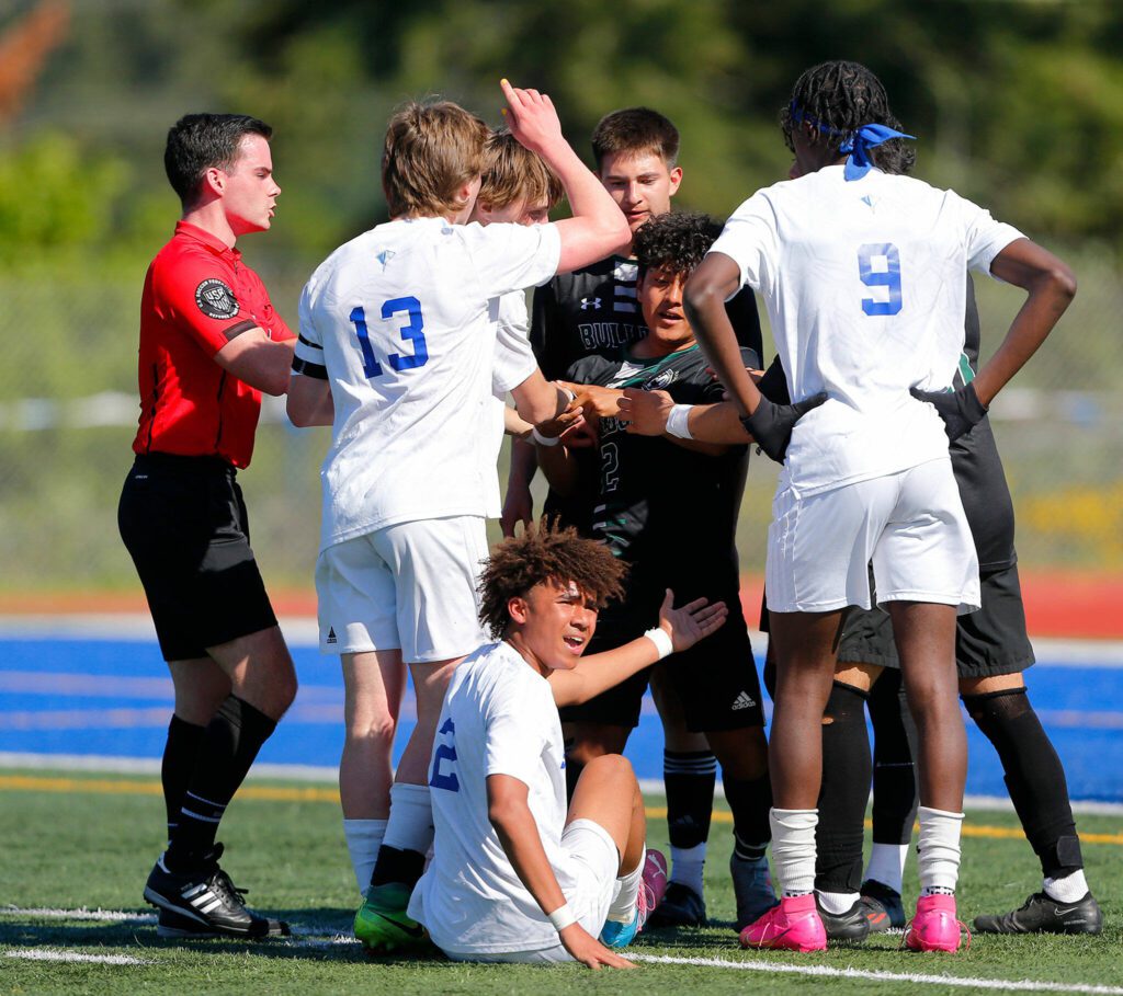 Shorewood and Mount Vernon players clash during the 3A District Championship match on Saturday, May 13, 2023, at Shoreline Stadium in Shoreline, Washington. (Ryan Berry / The Herald)
