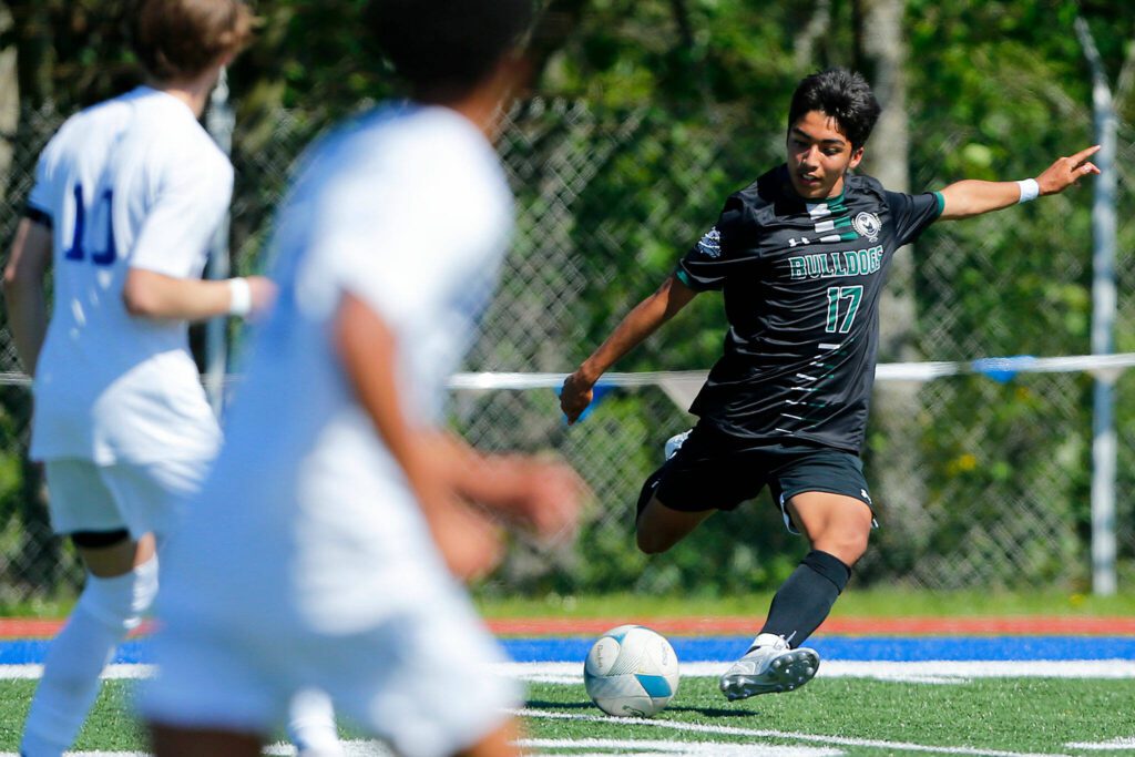 Mount Vernon’s Francisco Hernandez-Castaneda sends the ball into the box against Shorewood during the 3A District Championship match on Saturday, May 13, 2023, at Shoreline Stadium in Shoreline, Washington. (Ryan Berry / The Herald)
