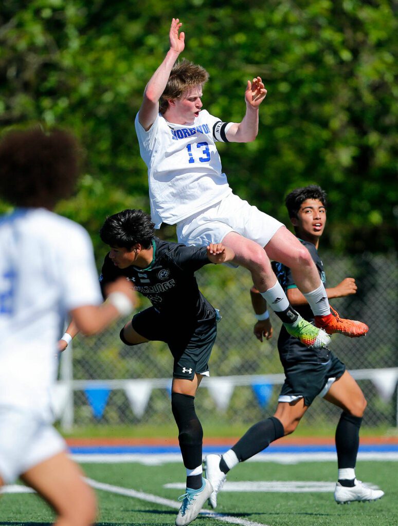 Shorewood’s Blaise Clapper takes to the air to head the ball up the field against Mount Vernon during the 3A District Championship match on Saturday, May 13, 2023, at Shoreline Stadium in Shoreline, Washington. (Ryan Berry / The Herald)
