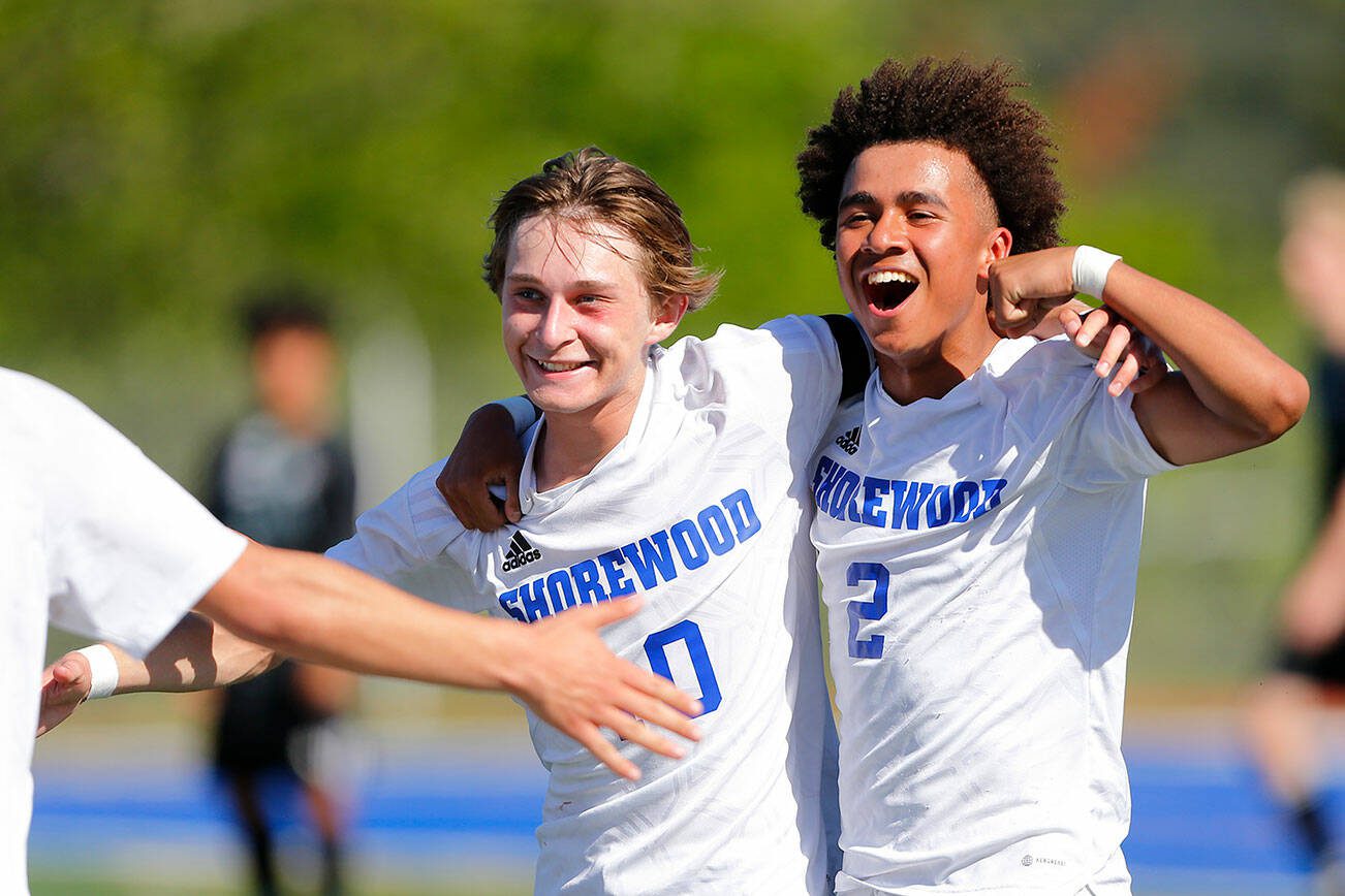 Shorewood midfielder Dzanan Fikic and attacker Jackson Smith celebrate a second team goal in the waning minutes of their 3A District Championship victory over Mount Vernon on Saturday, May 13, 2023, at Shoreline Stadium in Shoreline, Washington. (Ryan Berry / The Herald)