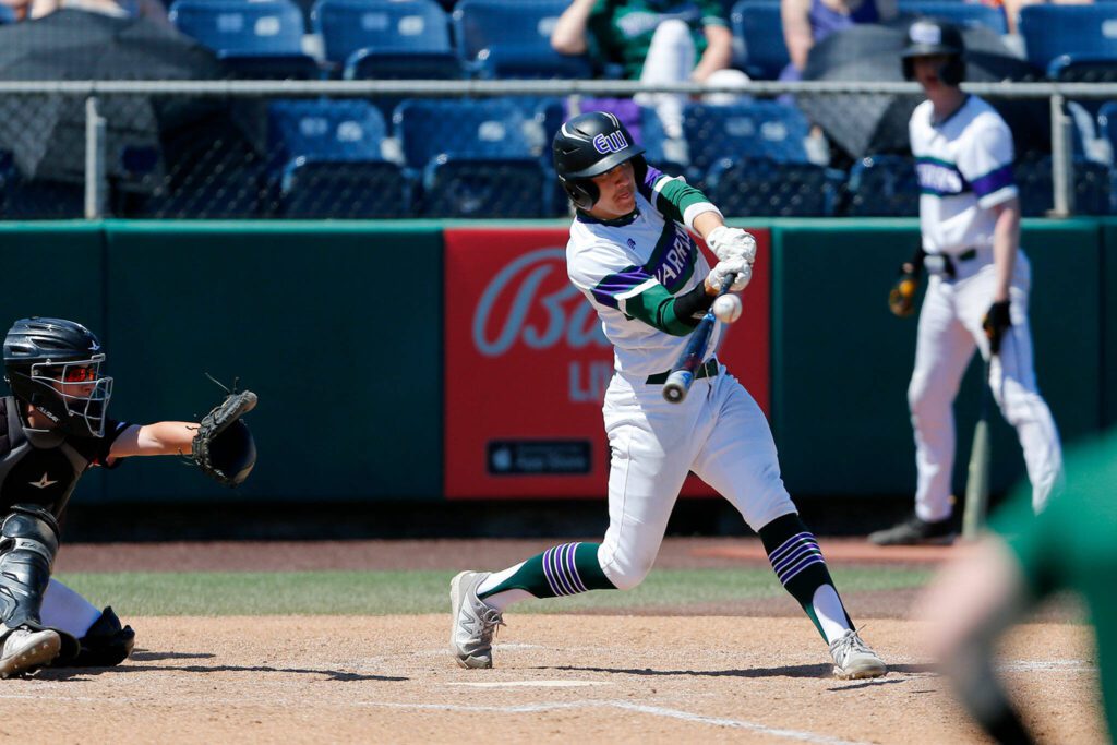 Edmonds-Woodway’s Drew Warner smacks a single to the outfield against Mountlake Terrace in the Class 3A District 1 title game Saturday at Funko Field in Everett. (Ryan Berry / The Herald)
