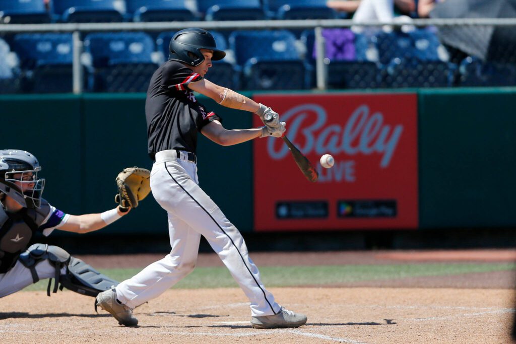 Mountlake Terrace’s Ryan Sturgill hits a single against Edmonds-Woodway in the 3A District title game on Saturday, May 13, 2023, at Funko Field in Everett, Washington. (Ryan Berry / The Herald)
