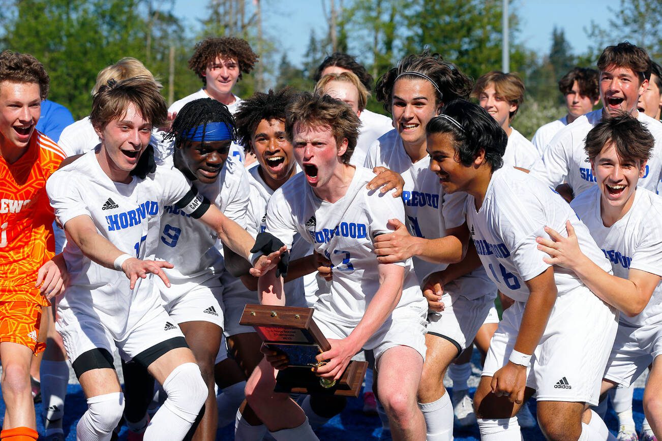 Shorewood players celebrate their victory over Mount Vernon in the 3A District Championship match on Saturday, May 13, 2023, at Shoreline Stadium in Shoreline, Washington. (Ryan Berry / The Herald)