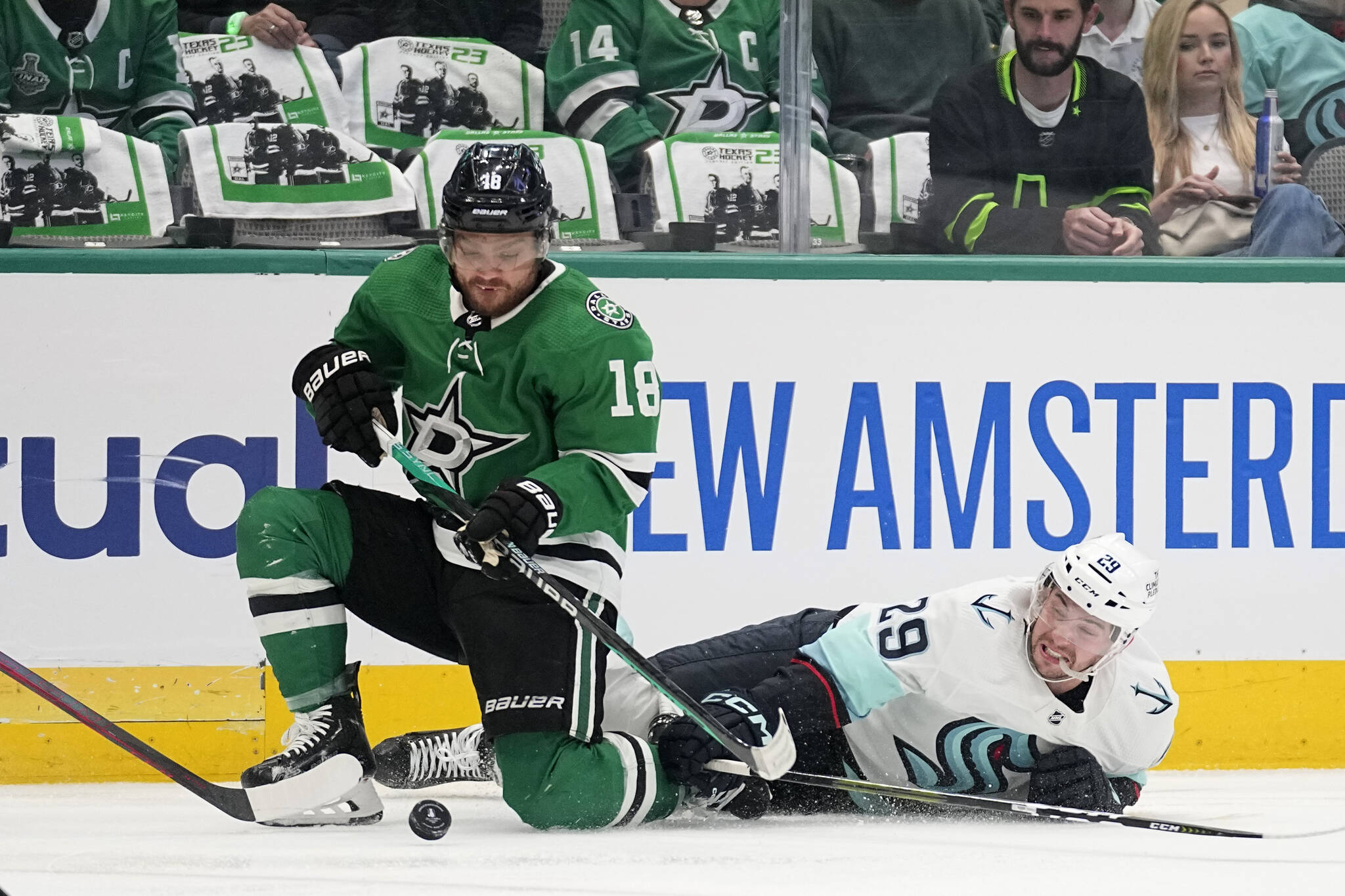 Stars center Max Domi (18) takes control of the puck in front of Kraken defenseman Vince Dunn during the first period of Game 7 of a second-round playoff series Monday in Dallas. (AP Photo/Tony Gutierrez)