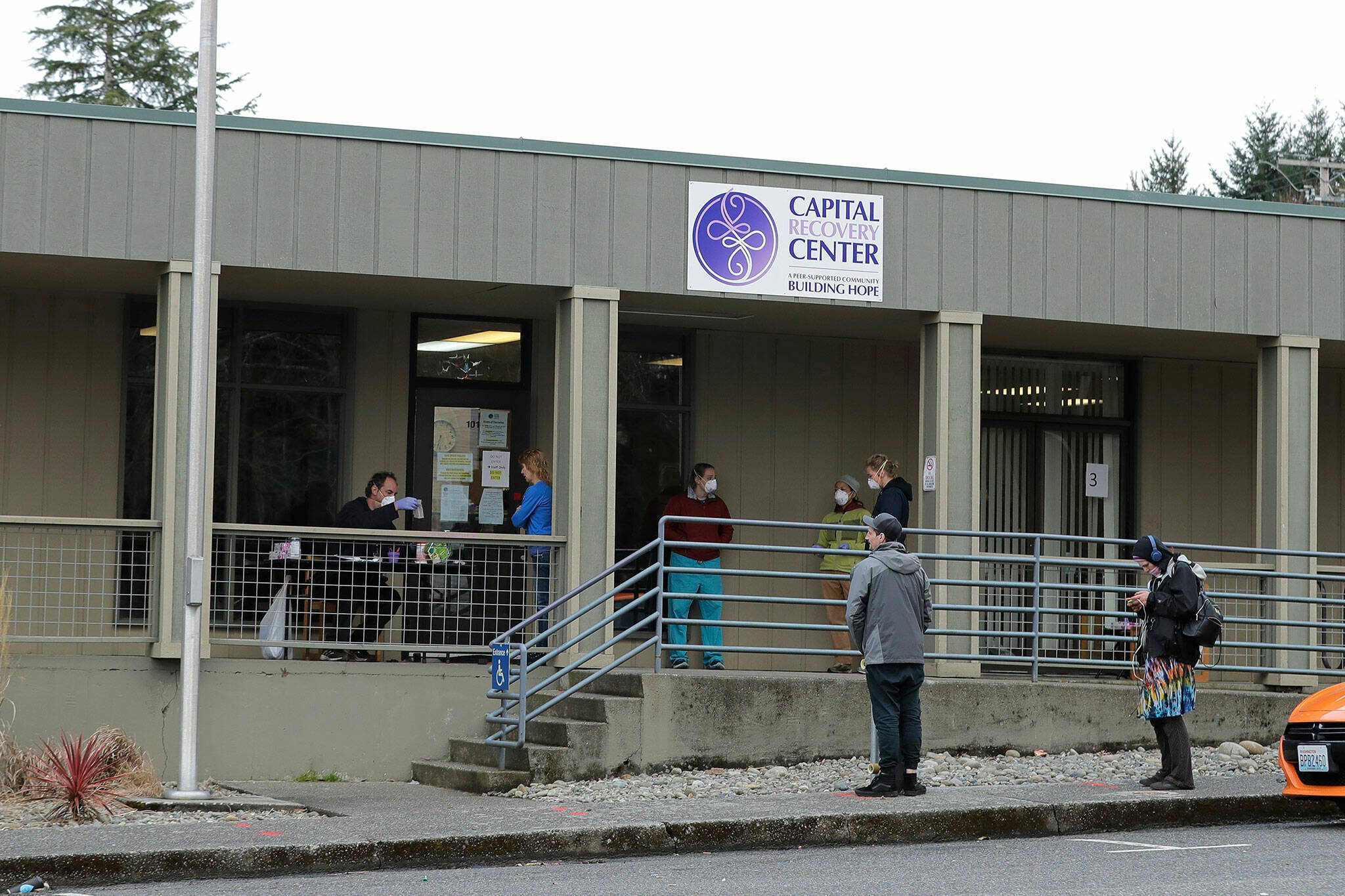 Patients line up to pick up medication for opioid addiction at a clinic in Olympia, Washington, on March 27, 2020. (AP Photo/Ted S. Warren, File)