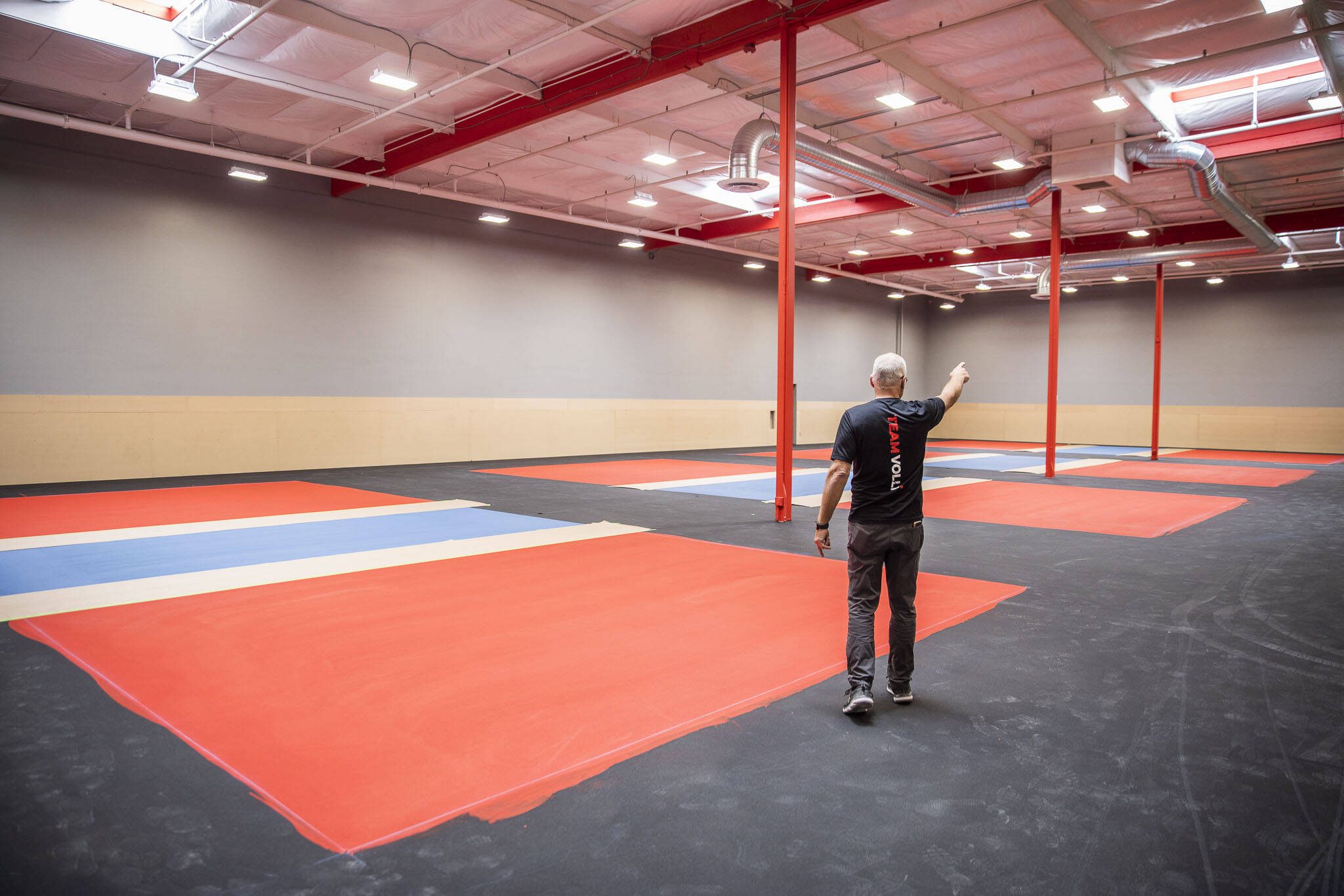 Kevin Aiello walks on the soon to be finished indoor pickle ball courts on Friday, May 19, 2023 in Marysville, Washington. (Olivia Vanni / The Herald)