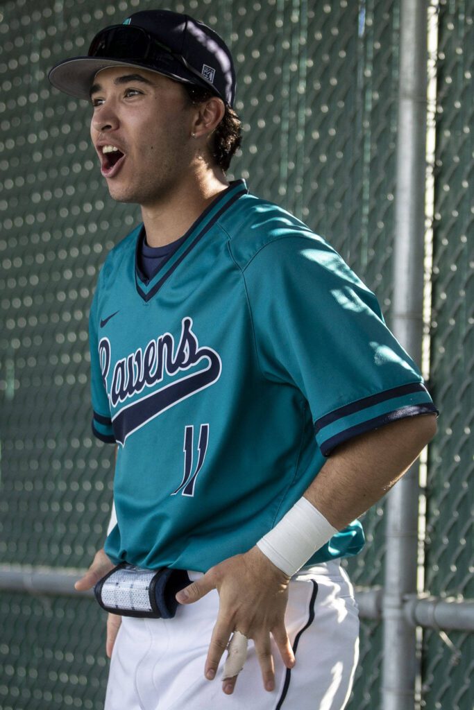 Auburn Riverside’s Andrew Shrader (11) reacts in the dugout during a game between Mountlake Terrace and Auburn Riverside in Mountlake Terrace, Washington on Tuesday, May 16, 2023. Mountlake Terrace won, 13-3. (Annie Barker / The Herald)
