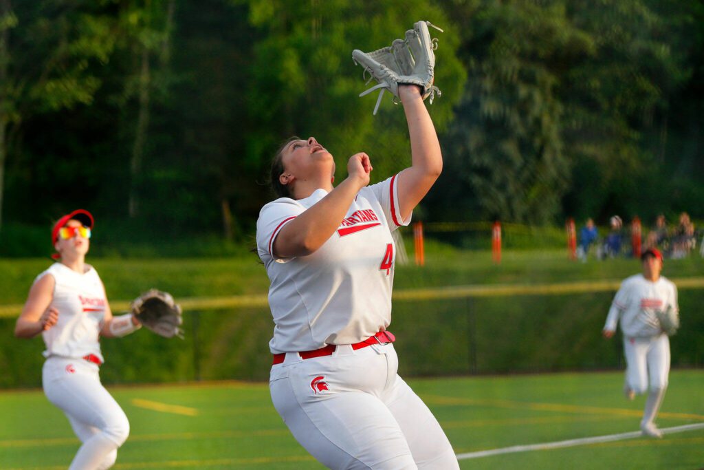 Stanwood’s Olivia Farr tracks a ball in foul territory against Snohomish during the Class 3A District 1 softball tournament Tuesday, May 16, 2023, at the Phil Johnson Ballfields in Everett, Washington. (Ryan Berry / The Herald)
