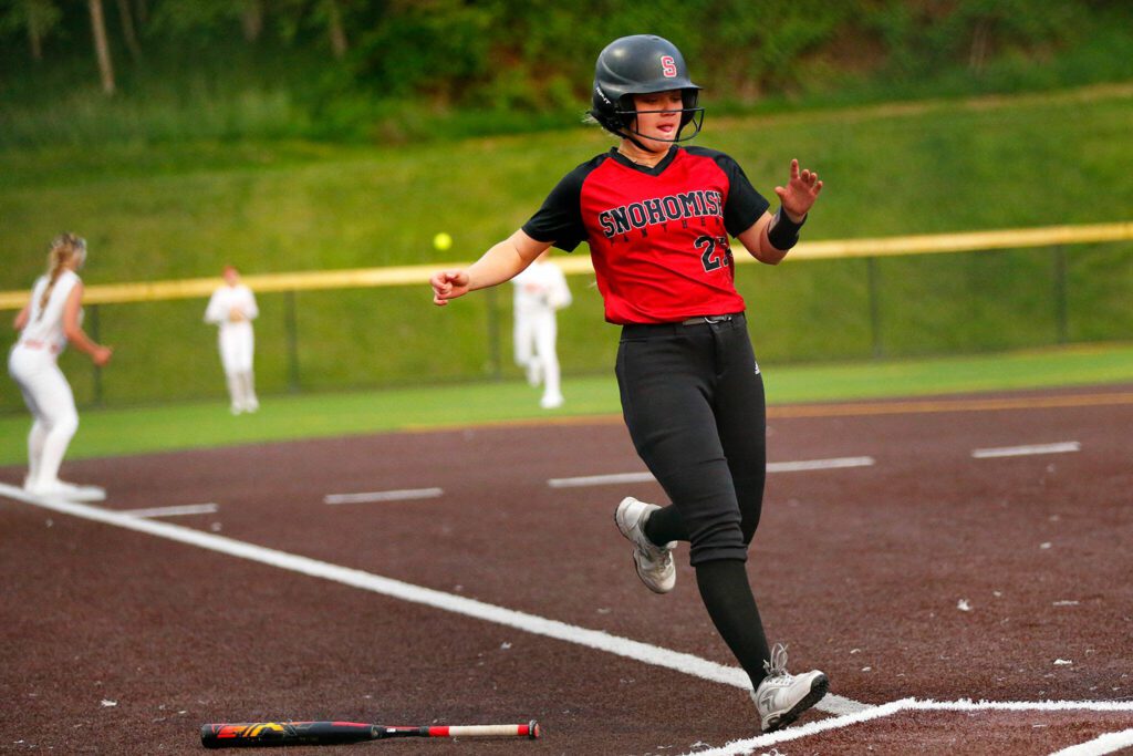 Snohomish’s Zoey Lynch crosses the plate as her team puts up a crooked number against Stanwood during the Class 3A District 1 softball tournament Tuesday, May 16, 2023, at the Phil Johnson Ballfields in Everett, Washington. (Ryan Berry / The Herald)
