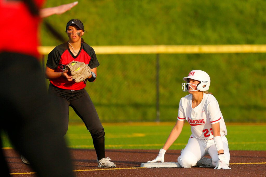Stanwood’s Madilynn Rel looks towards the ump after sliding in safe at second on a close play against Snohomish during the Class 3A District 1 softball tournament Tuesday, May 16, 2023, at the Phil Johnson Ballfields in Everett, Washington. (Ryan Berry / The Herald)
