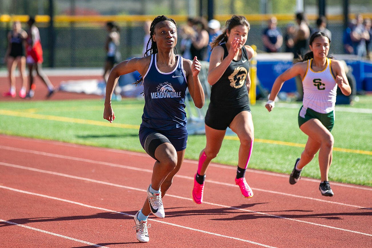 Meadowdale runner Tresley Love takes the lead in a Wesco 3A South prelim 100 meter dash Wednesday, May 10, 2023, at Edmonds Stadium in Edmonds, Washington. (Ryan Berry / The Herald)