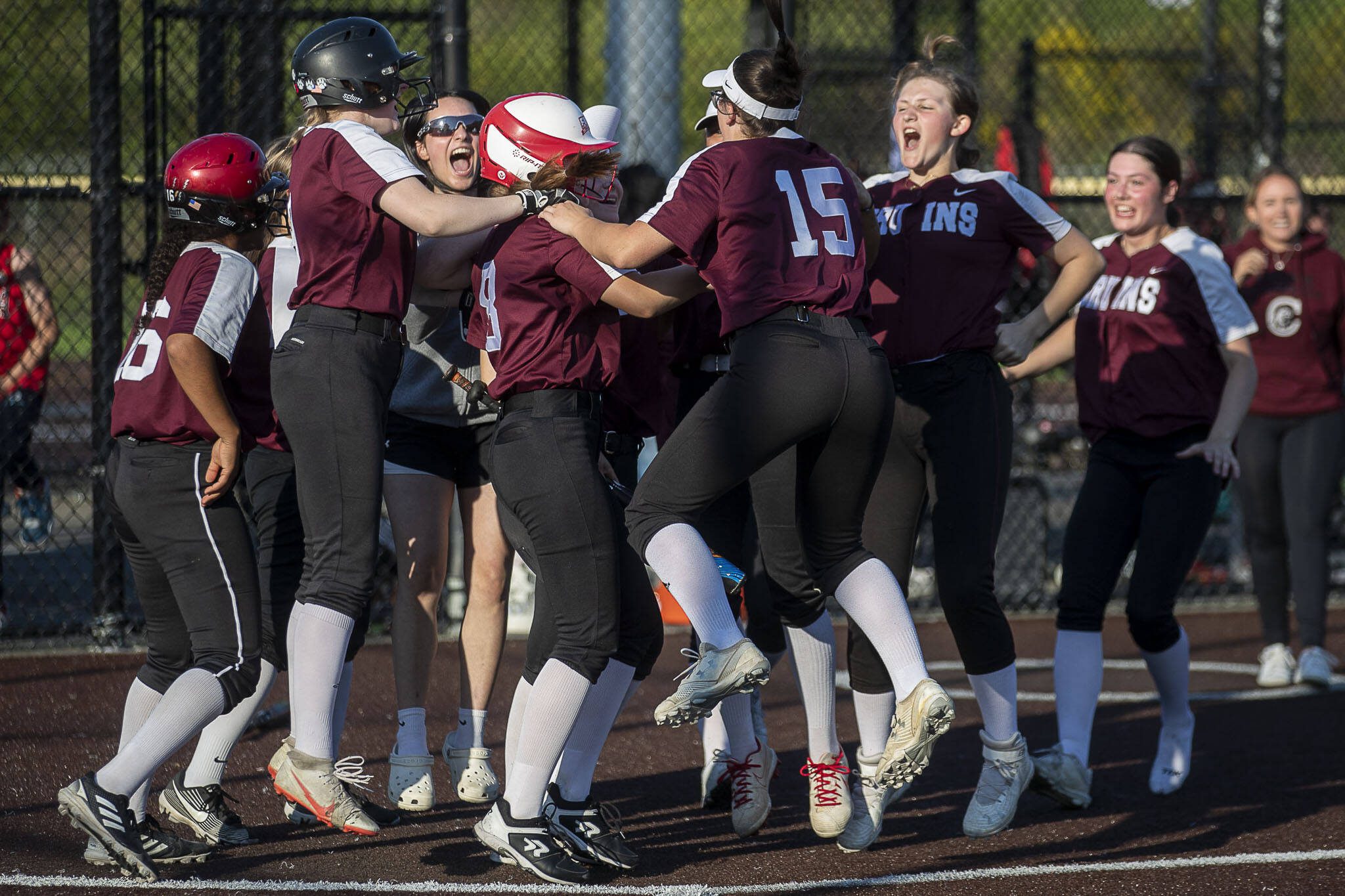 Cascade players celebrate during a game between Everett and Cascade at Phil Johnson Ballfields in Everett, Washington on Thursday, May 18, 2023. Cascade won in the ninth inning, 16-15. (Annie Barker / The Herald)