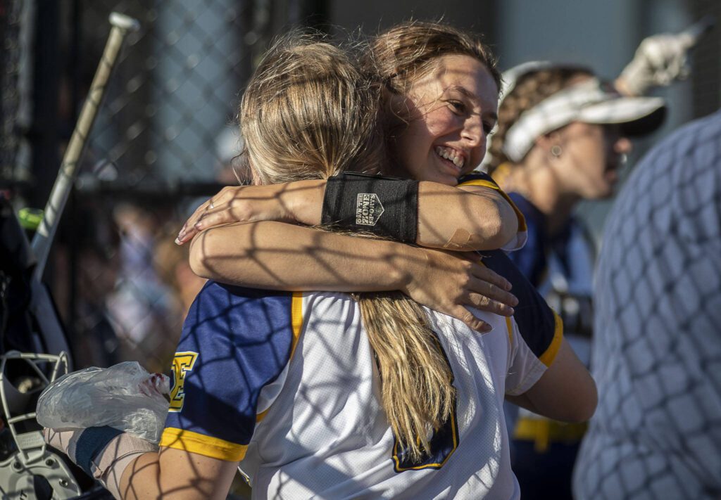 Everett players hug during a game between Everett and Cascade at Phil Johnson Ballfields in Everett, Washington on Thursday, May 18, 2023. Cascade won in the ninth inning, 16-15. (Annie Barker / The Herald)
