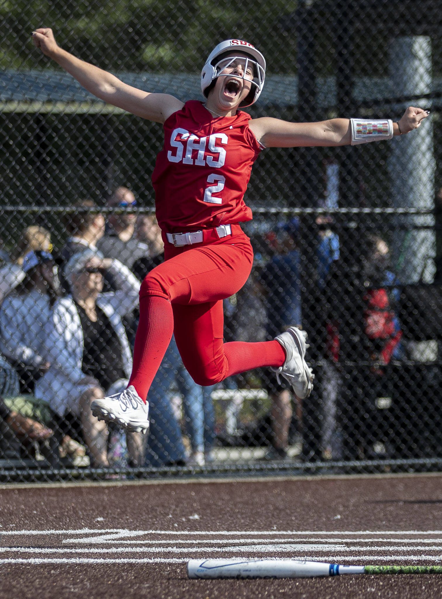 Stanwood’s Eliot McDonald (2) celebrates a run during a game between Marysville Getchell and Stanwood at Phil Johnson Ballfields in Everett, Washington on Thursday, May 18, 2023. Stanwood won, 12-1. (Annie Barker / The Herald)