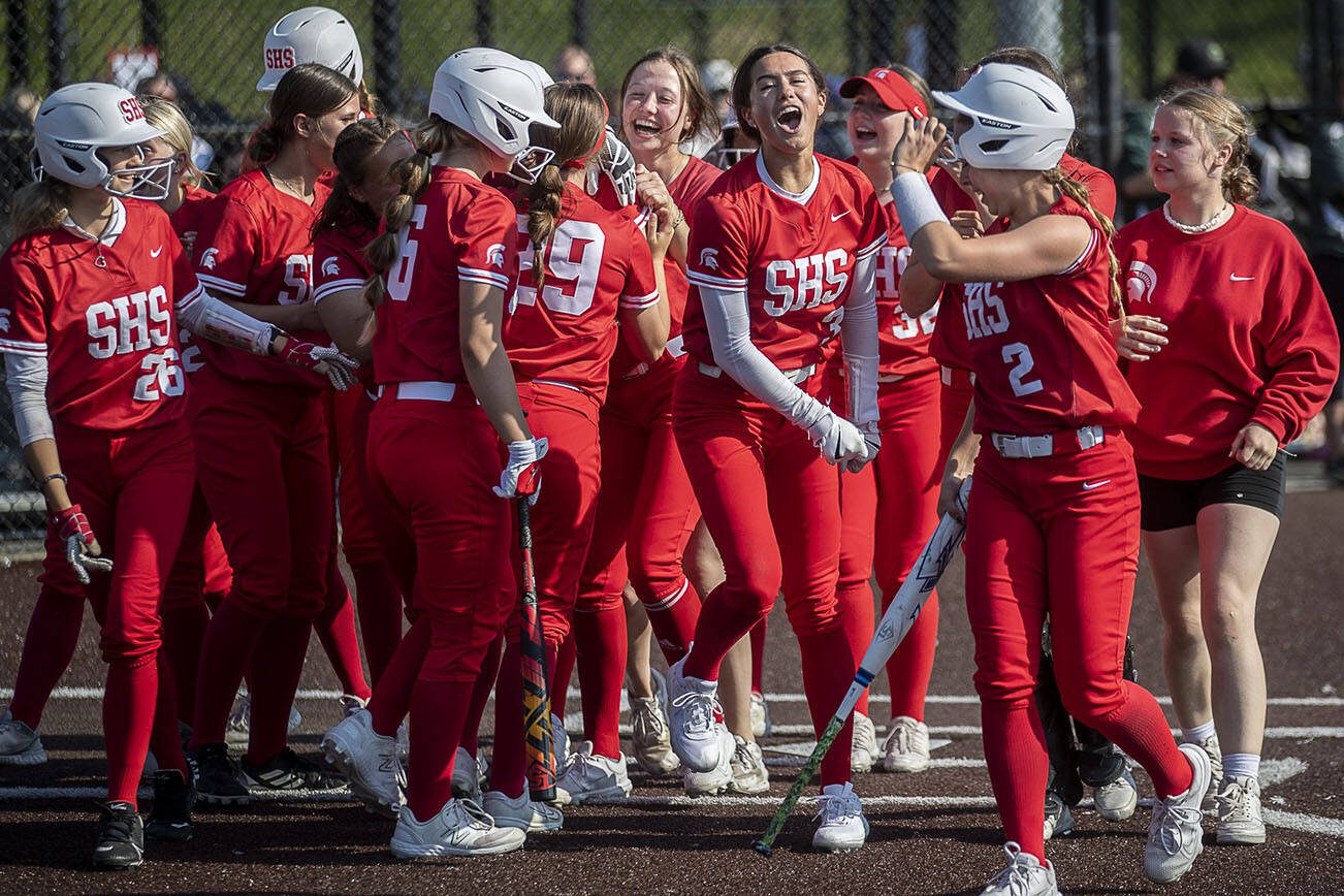 Stanwood players celebrate during a game between Marysville Getchell and Stanwood at Phil Johnson Ballfields in Everett, Washington on Thursday, May 18, 2023. Stanwood won, 12-1. (Annie Barker / The Herald)