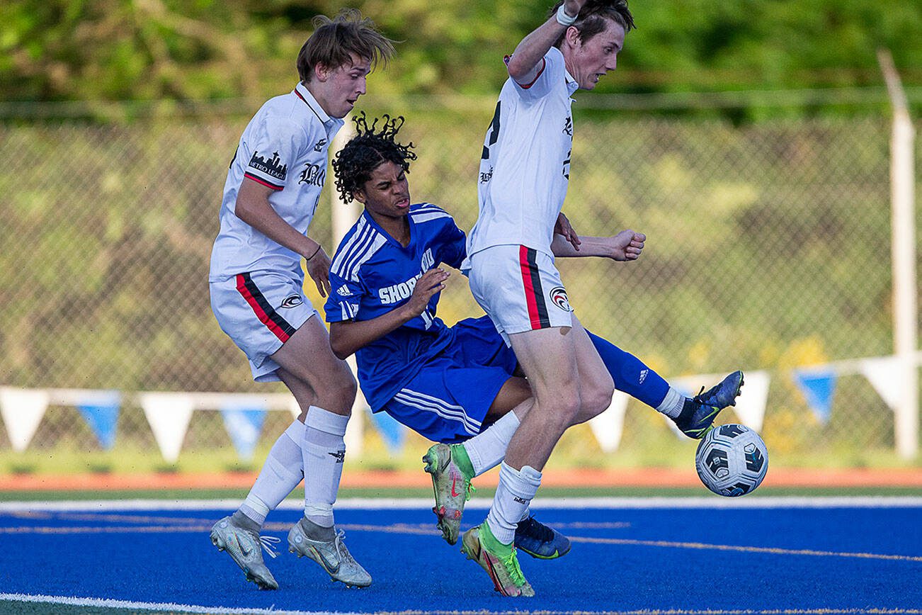 Shorewood’s Matthew Bereket is knocked down as he tries to get a shot off in the goal box during the game against Ballard on Thursday, May 18, 2023 in Shoreline, Washington. (Olivia Vanni / The Herald)