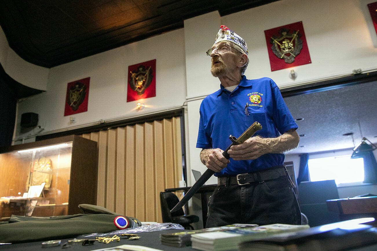 Quartermaster Donald Wischmann of VFW Post 2100 holds an 1828 French saber that Paul Davis Restoration of Greater Seattle restored before returning it to him on Friday, May 26, 2023, in Everett, Washington. Wischmann intends to display artifacts restored by Paul Davis inside the VFW. (Ryan Berry / The Herald)