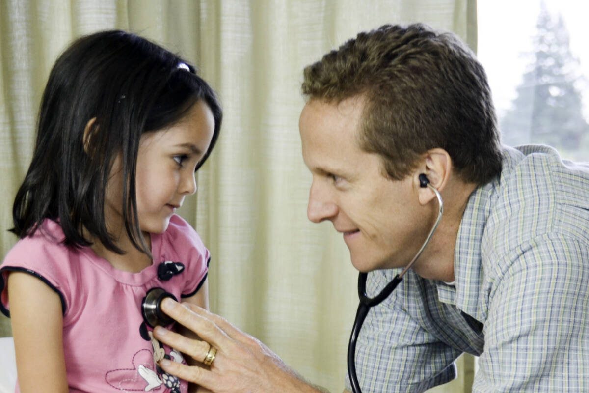 Dr. Lindstrom with a pediatric patient.