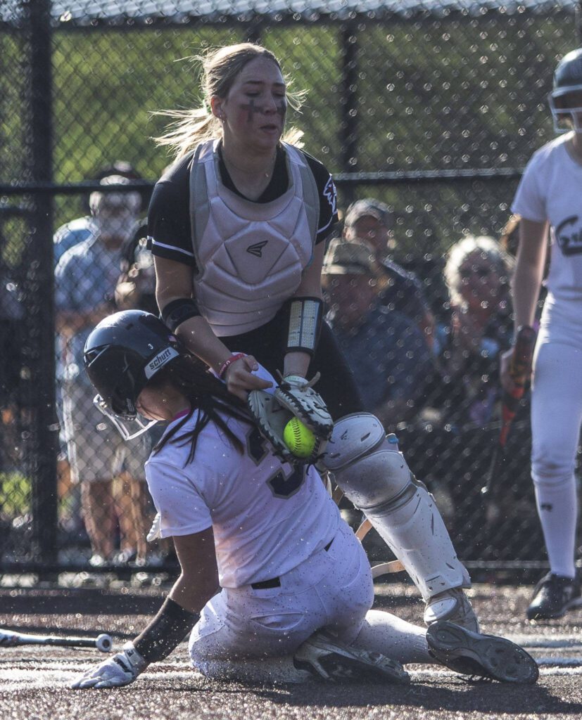 Glacier Peak’s Morgan Udy slides into home during the game against Eastlake on Friday, May 19, 2023 in Everett, Washington. (Olivia Vanni / The Herald)
