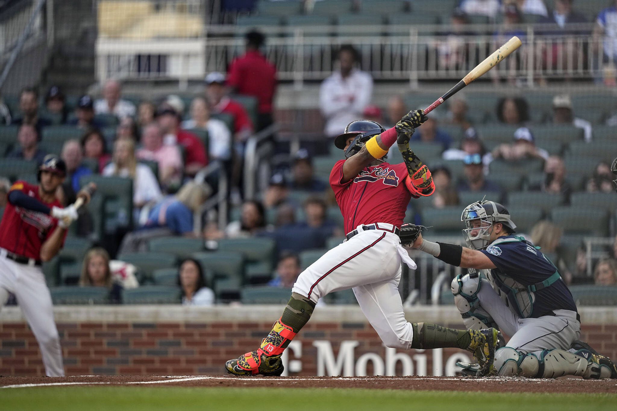 The Braves’ Ronald Acuna Jr. hits a double during the first inning of a game against the Mariners on Friday in Atlanta. (AP Photo/Brynn Anderson)