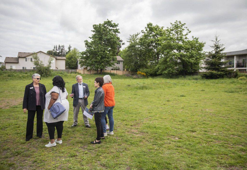 People gather for the ground breaking of the Housing Hope Madrona Highlands project on Tuesday, May 23, 2023 in Edmonds, Washington. (Olivia Vanni / The Herald)
