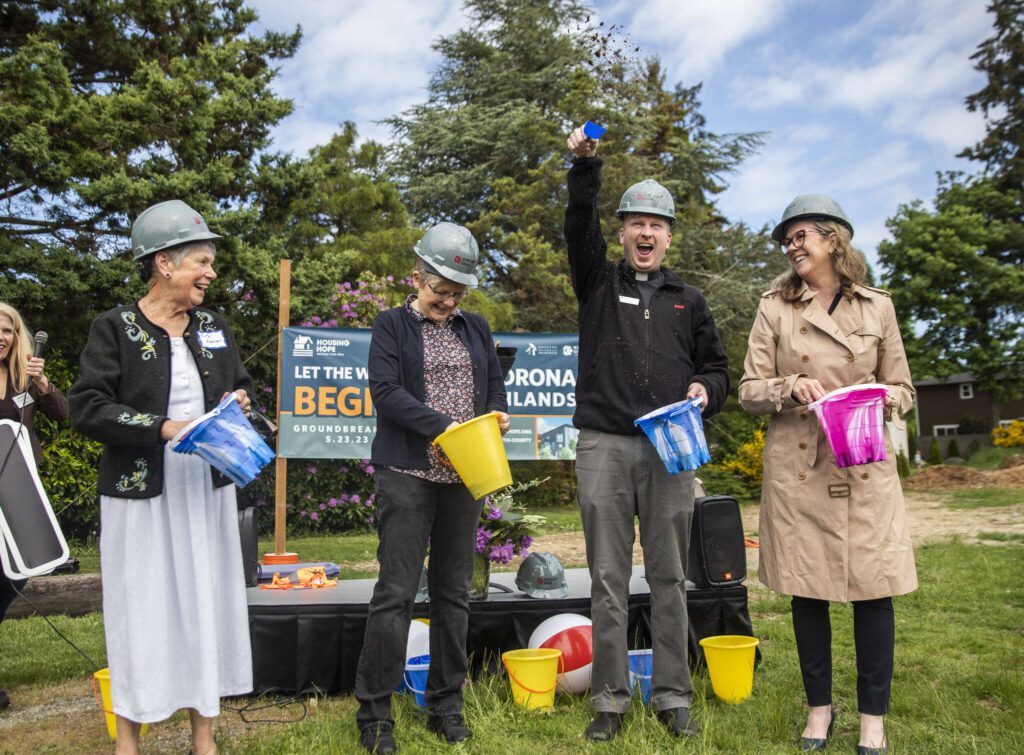 Members of the Edmonds Luthern Church help with the ground breaking of the Housing Hope Madrona Highlands project on Tuesday, May 23, 2023 in Edmonds, Washington. (Olivia Vanni / The Herald)

