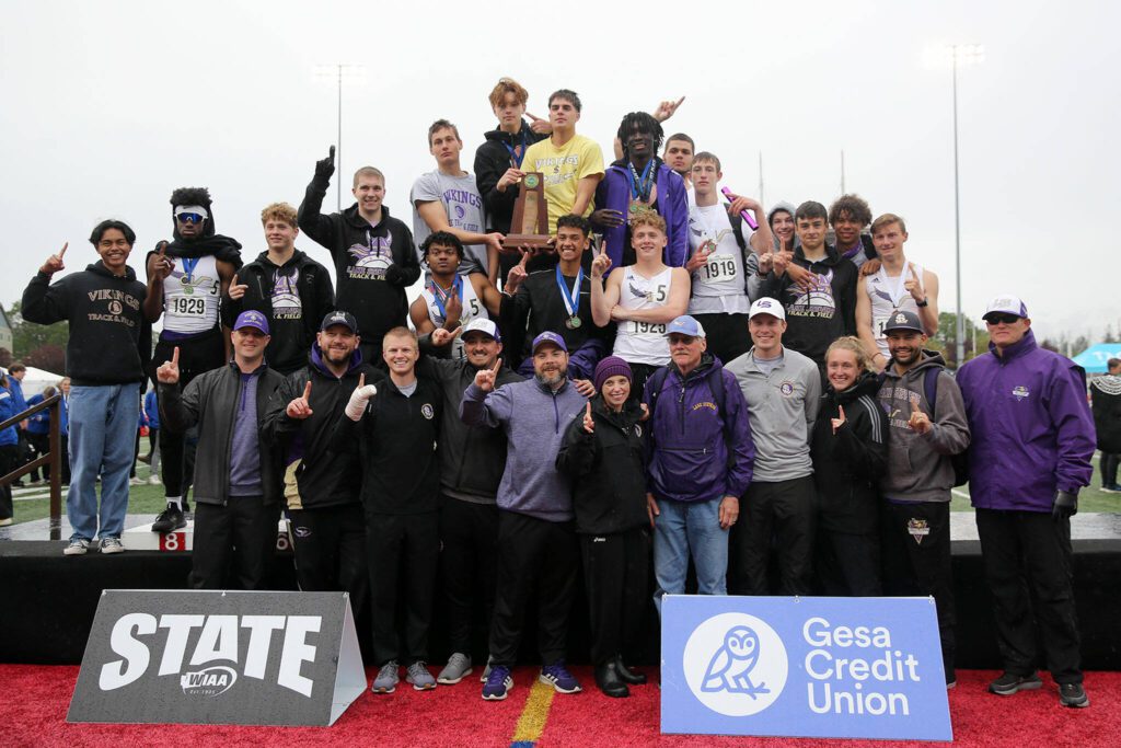 The Lake Stevens boys track and field team celebrates winning the Class 4A state championship May 28, 2022, at Mount Tahoma High School in Tacoma. (Ryan Berry / The Herald)
