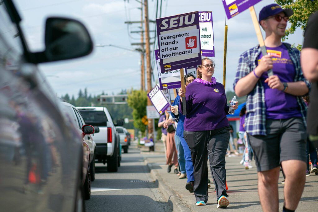 Bargaining committee member Laura Steere joins in on the picket line during a union protest in front of EvergreenHealth Monroe on Wednesday, May 24, 2023, in Monroe, Washington. (Ryan Berry / The Herald)
