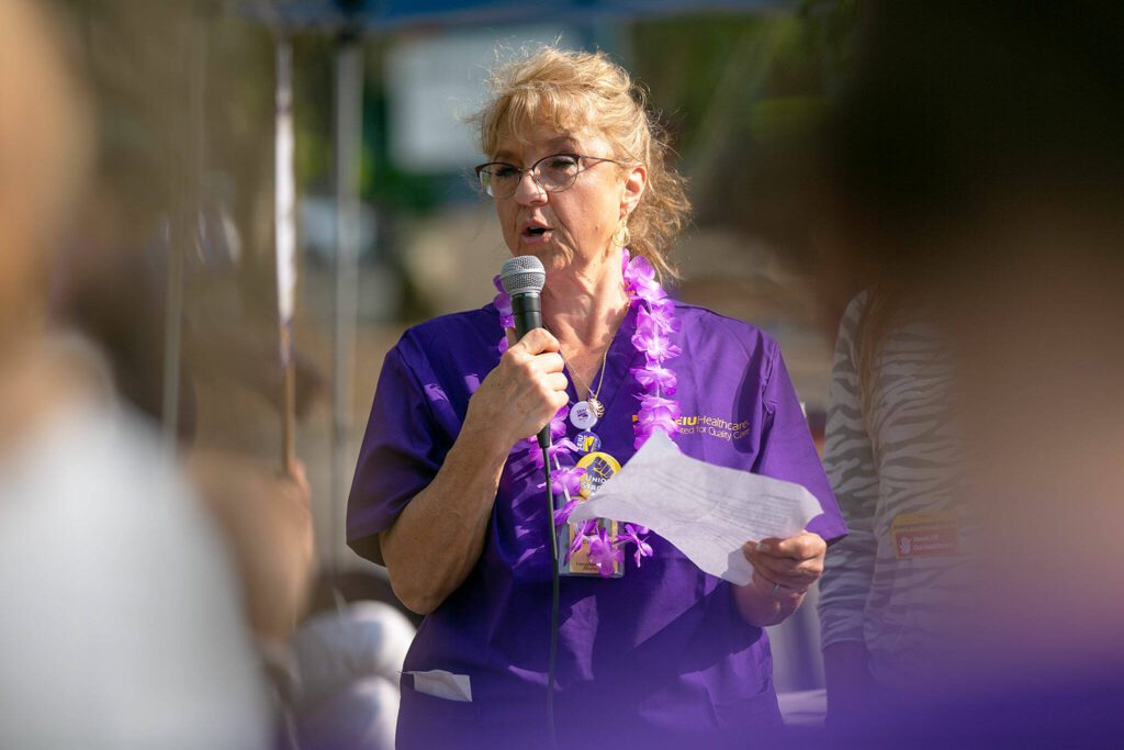 Nancy L. Anderson, RN, helps guide an SEIU Healthcare 1199NW demonstration in front of EvergreenHealth Monroe on Wednesday, May 24, 2023, in Monroe, Washington. (Ryan Berry / The Herald)
