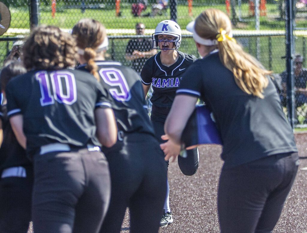 Kamiak’s Tyler Karabach is greeted at home after hitting a home run during a game against Skyline on May 19 in Everett. (Olivia Vanni / The Herald)
