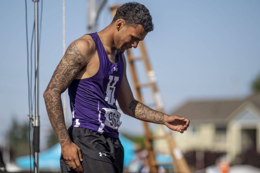 Kamiak’s Jaquan Means reacts to winning heat 3 of the boys 110 meter hurdle finals at Mount Tahoma High School in Tacoma, Washington on Friday, May 26, 2023. (Annie Barker / The Herald)
