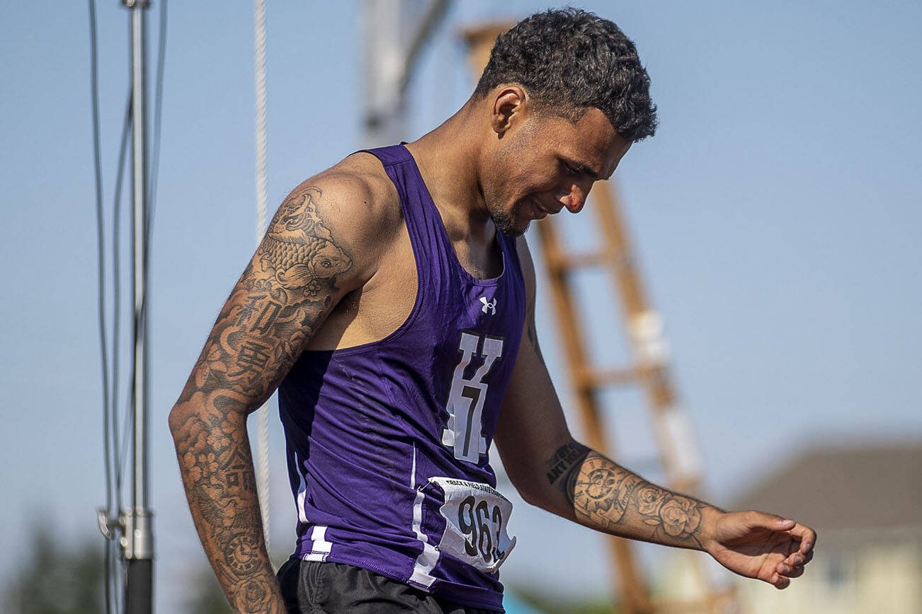 Kamiak’s Jaquan Means reacts to winning heat 3 of the boys 110 meter hurdle finals at Mount Tahoma High School in Tacoma, Washington on Friday, May 26, 2023.  (Annie Barker / The Herald)