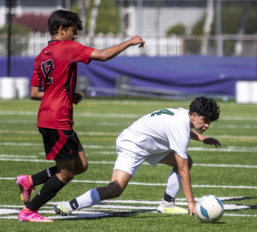 Edmonds-Woodway’s Hector Perez-Toro (14) trips during a game between Edmonds-Woodway and Lincoln of Seattle at Sparks Stadium in Puyallup, Washington on Friday, May 26, 2023. Edmonds-Woodway lost, 6-1. (Annie Barker / The Herald)
