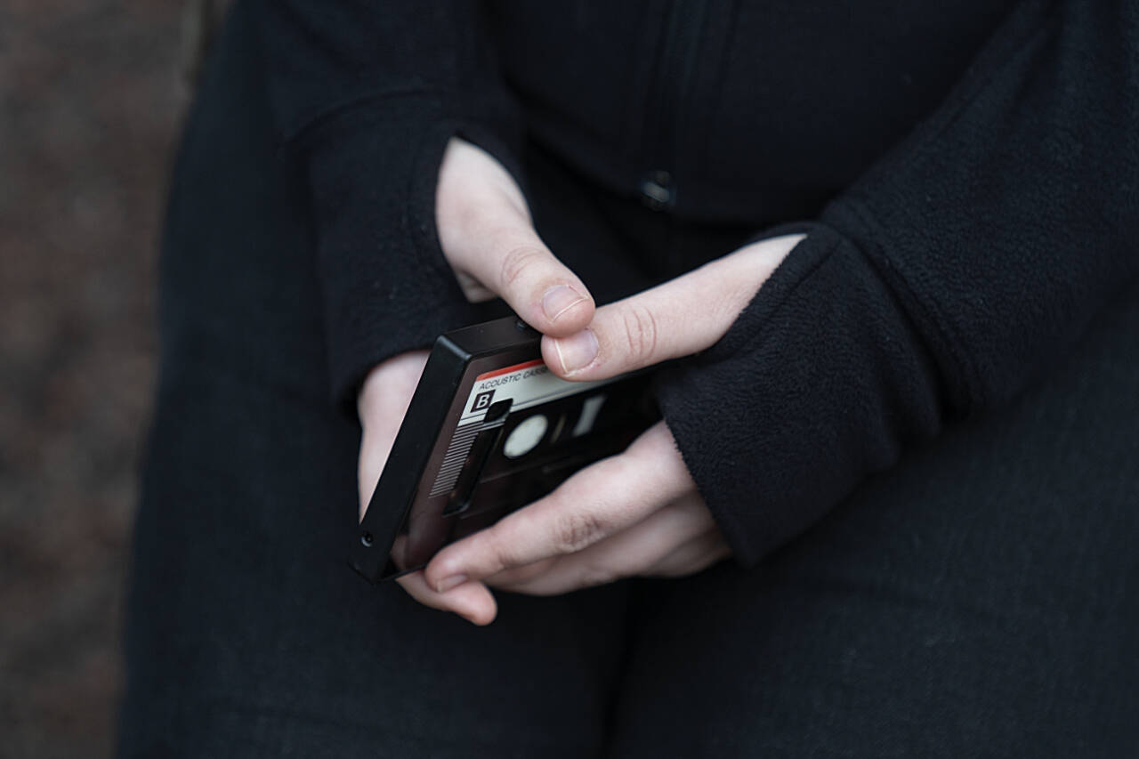A teenager holds her phone as she sits for a portrait near her home in Illinois, in March, 2023. The U.S. Surgeon General is warning there is not enough evidence to show that social media is safe for young people — and is calling on tech companies, parents and caregivers to take “immediate action to protect kids now.” (Erin Hooley / Associated Press file photo)