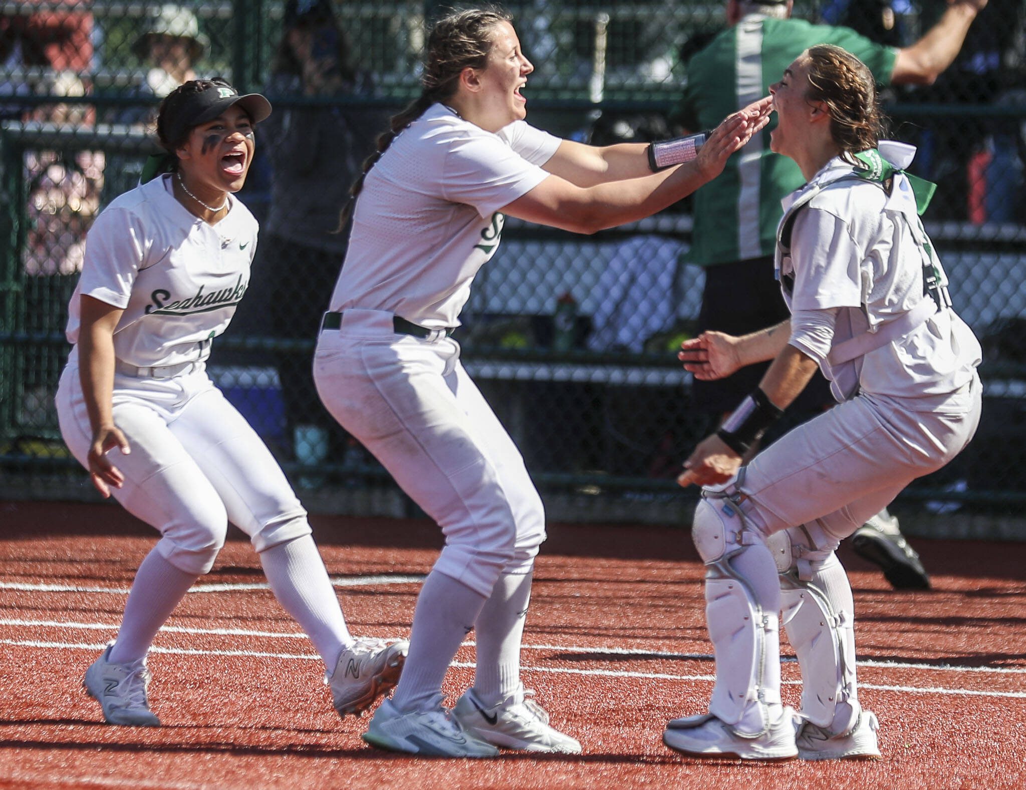 Peninsula players celebrate during the 3A softball championship game between Snohomish and Peninsula at the Lacey-Thurston County Regional Athletic Complex in Olympia, Washington on Saturday, May 27, 2023. Snohomish lost, 4-1. (Annie Barker / The Herald)