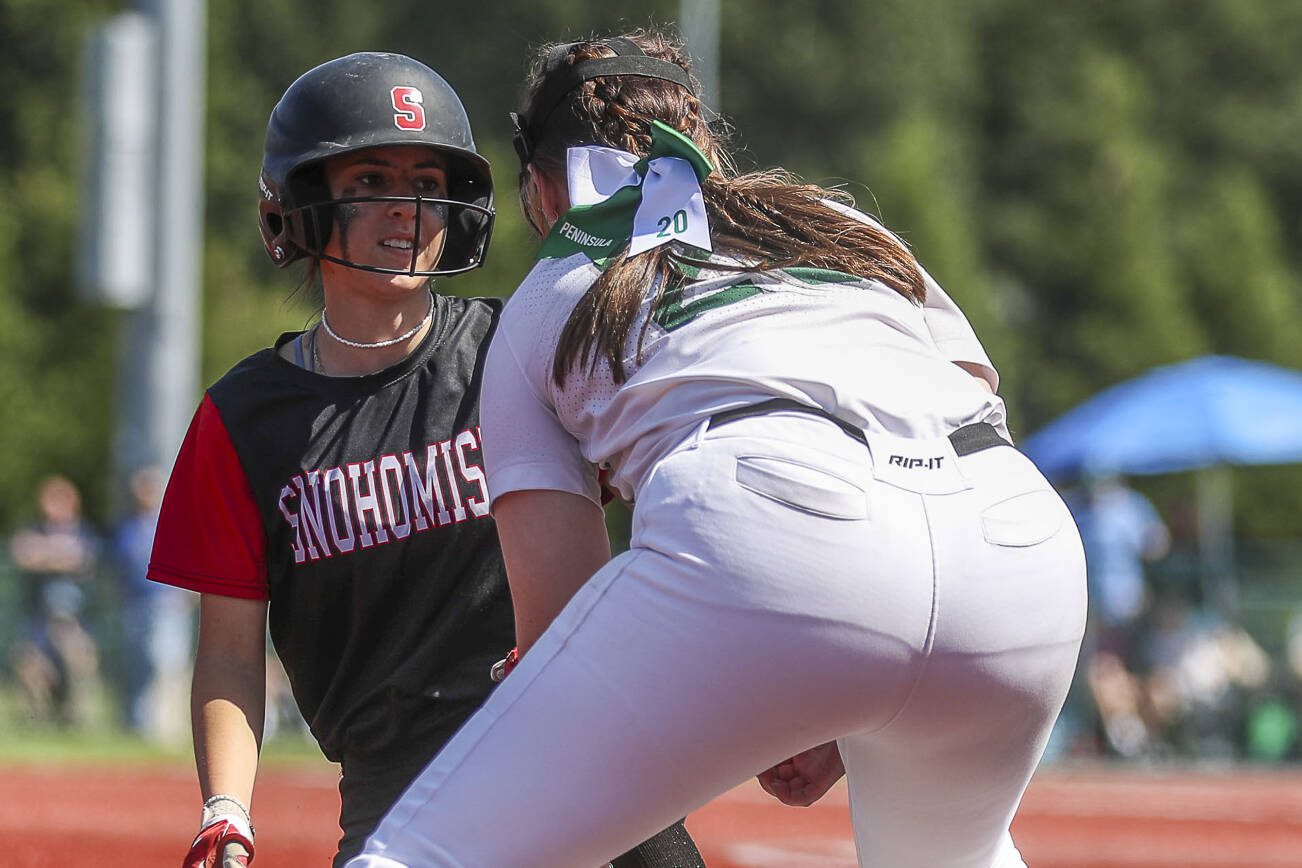 A Snohomish player slides safe into third during the 3A softball championship game between Snohomish and Peninsula at the Lacey-Thurston County Regional Athletic Complex in Olympia, Washington on Saturday, May 27, 2023. Snohomish lost, 4-1. (Annie Barker / The Herald)