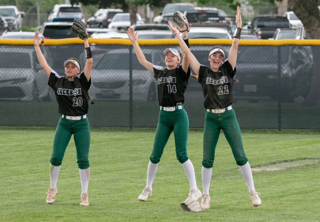 Jackson players dance to the YMCA song between innings during the WIAA Class 4A state softball title game on Saturday, May 27, 2023, in Richland. (TJ Mullinax / For The Herald)
