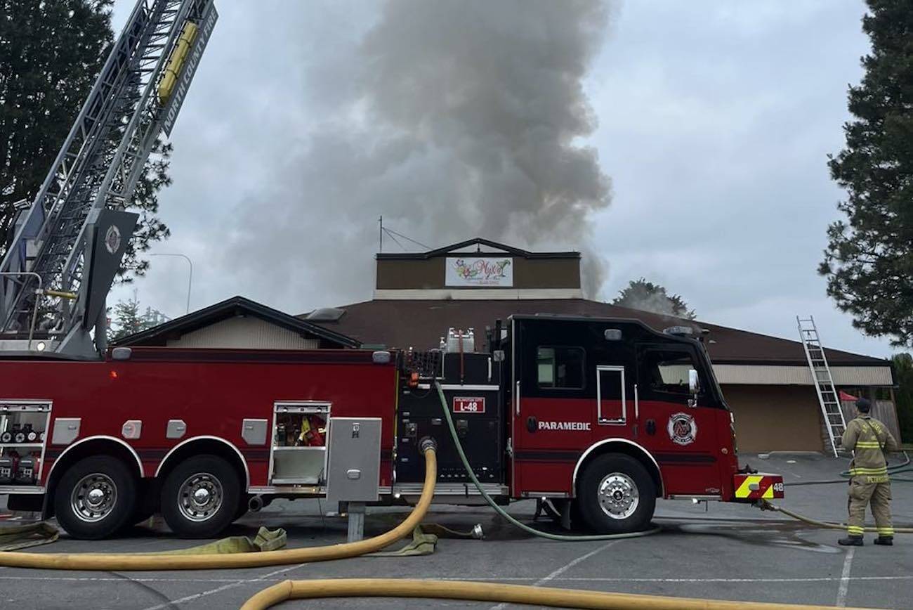 Smoke comes out of the roof of ReMyx'd, a restaurant on Smokey Point Drive, on Sunday, May 28, 2023, in Arlington, WA. (IAFF Local 3438)