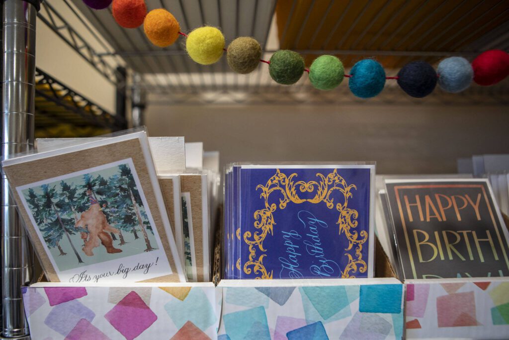 Cards designed by Chelsea Bridges Wagner, 35, at her home in Snohomosh, Washington on Wednesday, March 29, 2023. (Annie Barker / The Herald)
