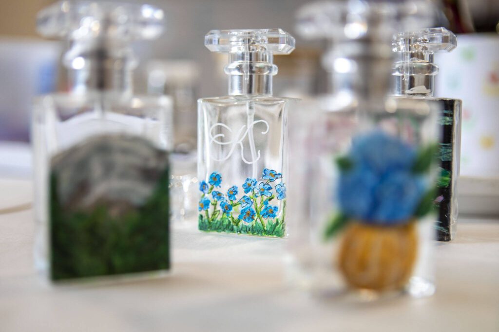 Glass bottles painted by Chelsea Bridges Wagner, 35, at her home in Snohomosh, Washington on Wednesday, March 29, 2023. (Annie Barker / The Herald)

