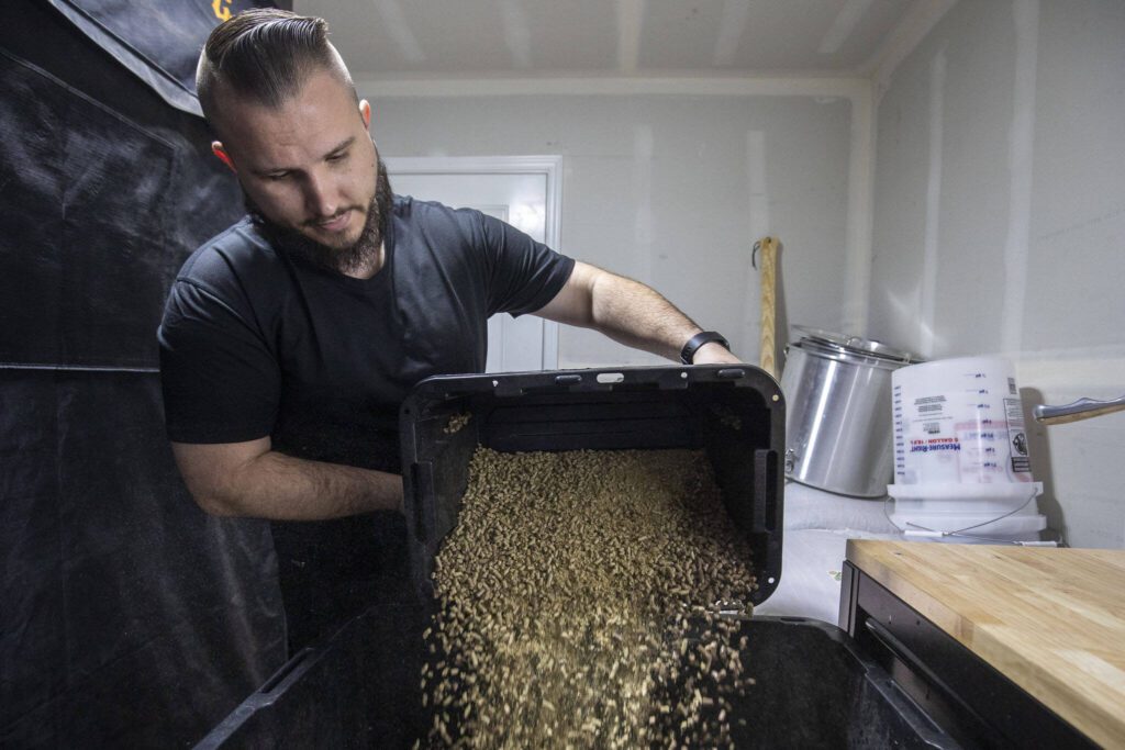 Nathanael Engen prepares the mixture to cultivate mushrooms at his property in Everett, Washington on Monday, March 27, 2023. Engen summarizes his business as “cultivating mushrooms, and healthy communities”. (Annie Barker / The Herald)
