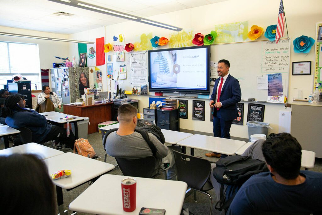 Jonnathan Yepez Carino speaks with Auliilani De La Cruz’s class about financial literacy during a presentation at Mariner High on Wednesday, May 31, 2023, in Everett, Washington. (Ryan Berry / The Herald)

