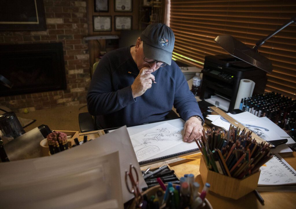 Brian Basset pauses while working on an upcoming Sunday comic in his studio on Wednesday, June 7, 2023, in Edmonds, Washington. (Olivia Vanni / The Herald)
