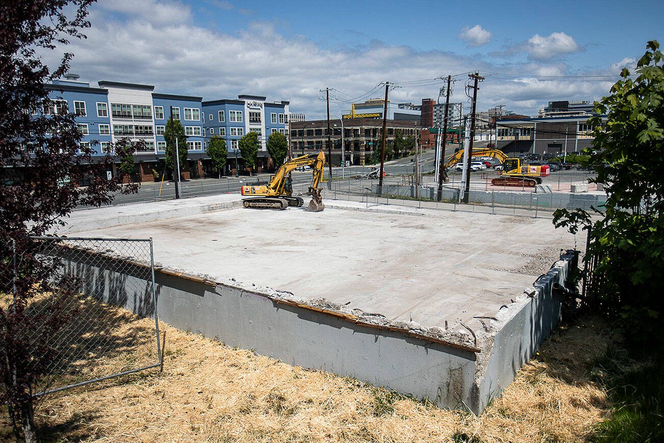 The site of a former 76 gas station and a handful of century old buildings will be the location for new apartments buildings at the corner of Pacific and Rucker on Wednesday, May 31, 2023 in Everett, Washington. (Olivia Vanni / The Herald)