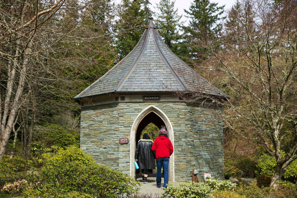 Two visitors enter Meerkerk Gardens on Wednesday, April 5, 2023, in Greenbank, Washington. (Ryan Berry / The Herald)
